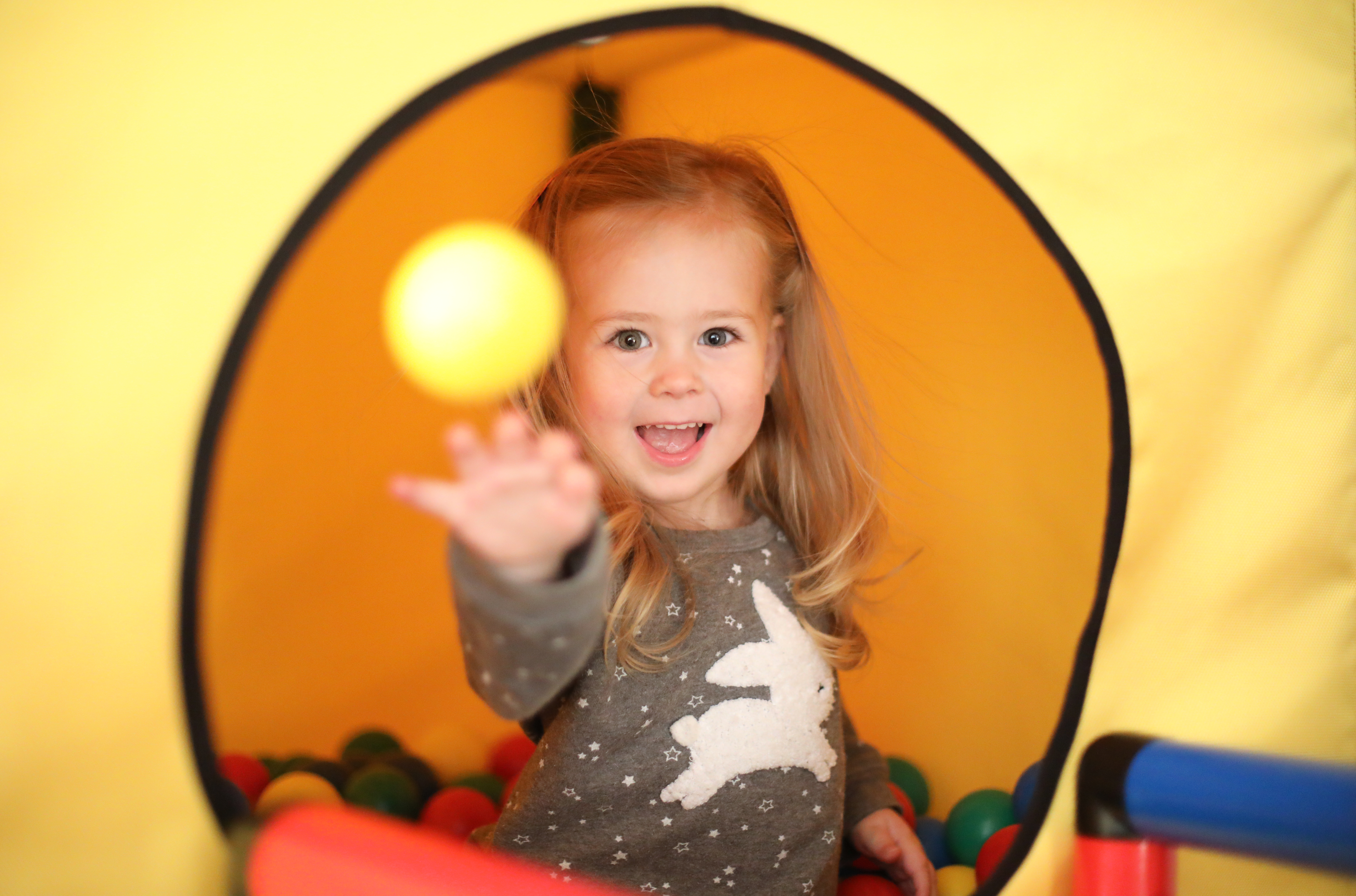 Girl playing in QUADRO ball pit Girl playing in QUADRO ball pit